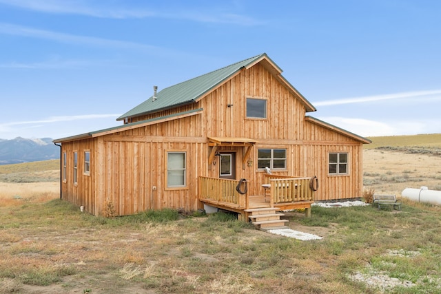 back of house with a mountain view