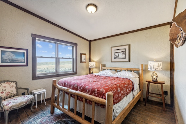 bedroom with crown molding, dark wood-type flooring, and vaulted ceiling