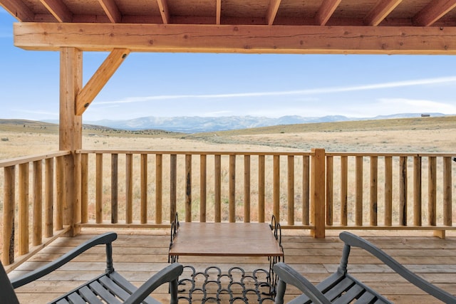 wooden terrace with a mountain view