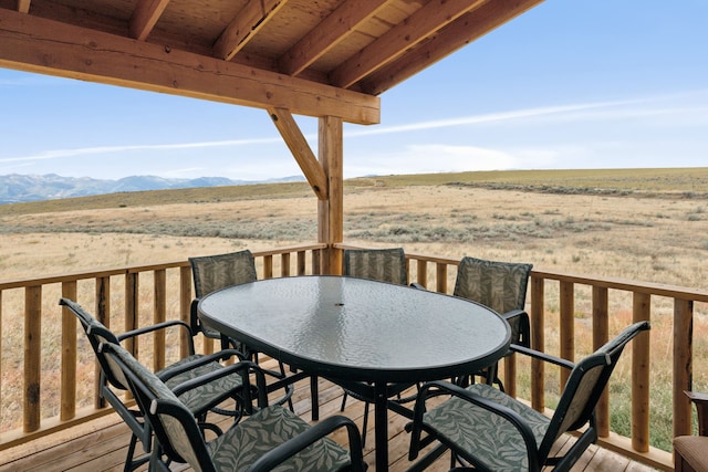 wooden terrace featuring a rural view