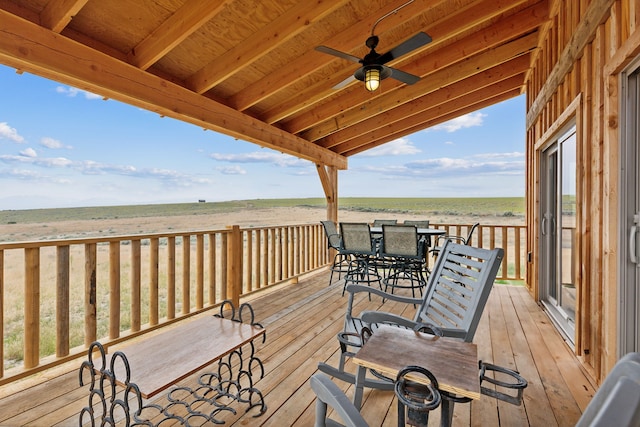 deck with ceiling fan and a rural view