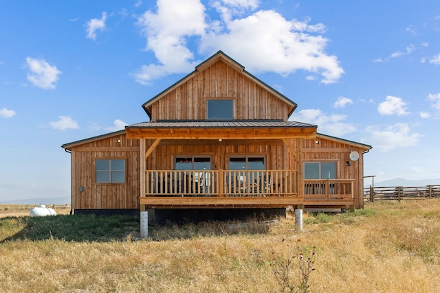 back of property featuring a porch