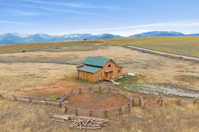 birds eye view of property featuring a mountain view and a rural view