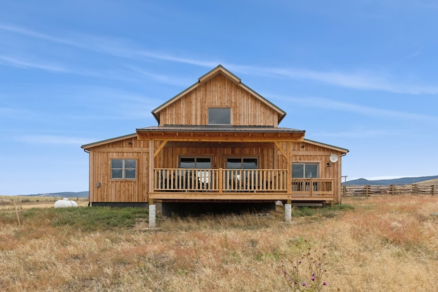 back of house featuring a rural view