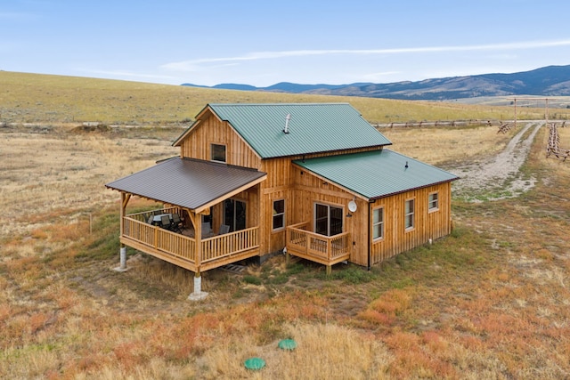 birds eye view of property featuring a mountain view and a rural view