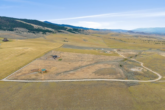 birds eye view of property with a mountain view and a rural view