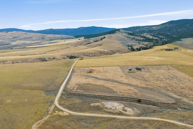 birds eye view of property with a mountain view and a rural view