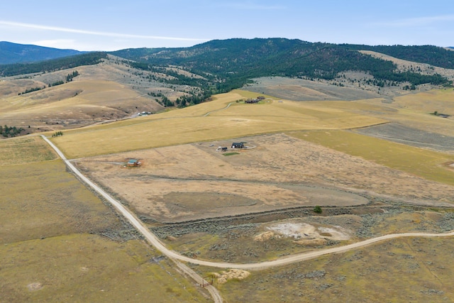 drone / aerial view with a mountain view and a rural view