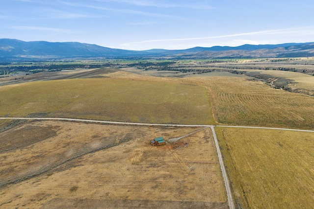 drone / aerial view featuring a mountain view and a rural view