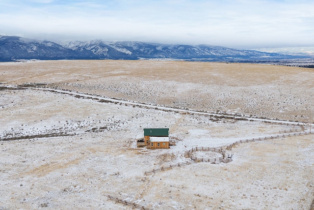 birds eye view of property with a mountain view and a rural view