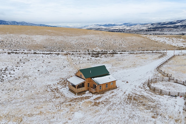 birds eye view of property featuring a mountain view and a rural view