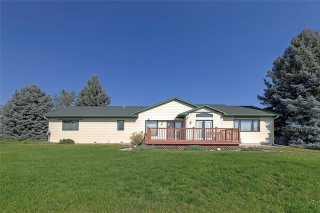 single story home with a front yard and a deck