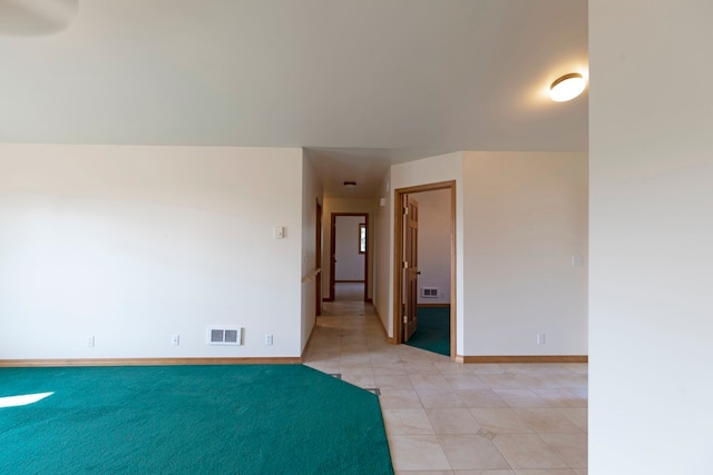 empty room with light tile patterned floors