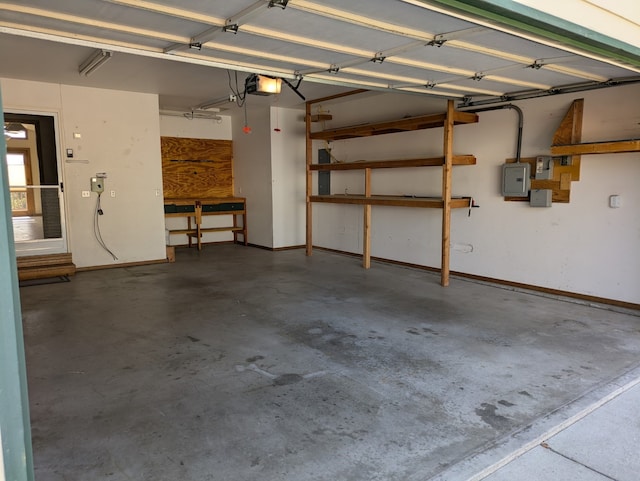 garage featuring a garage door opener and electric panel