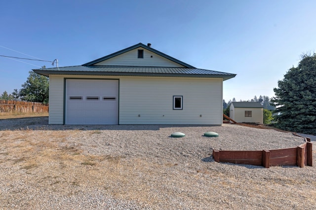 view of side of home with a garage