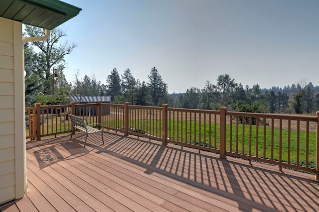 wooden deck with a yard