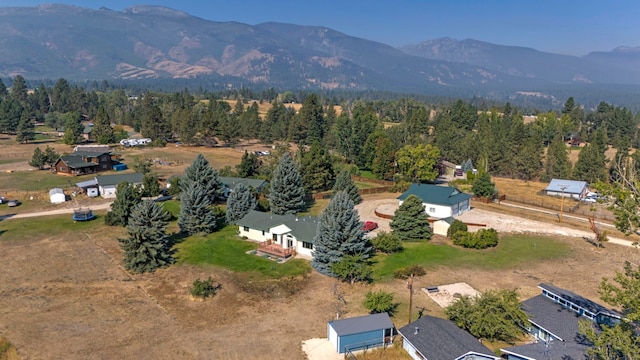 birds eye view of property featuring a mountain view