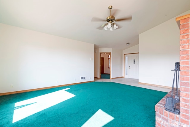 unfurnished living room with lofted ceiling, ceiling fan, and carpet floors