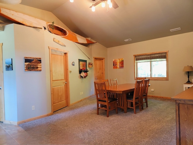dining space featuring lofted ceiling, visible vents, carpet, and ceiling fan