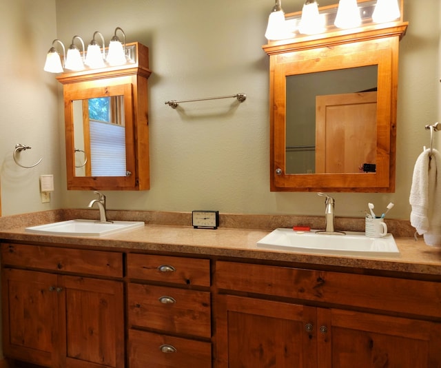 bathroom with a sink and double vanity