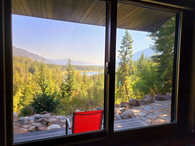 details featuring a mountain view and a view of trees