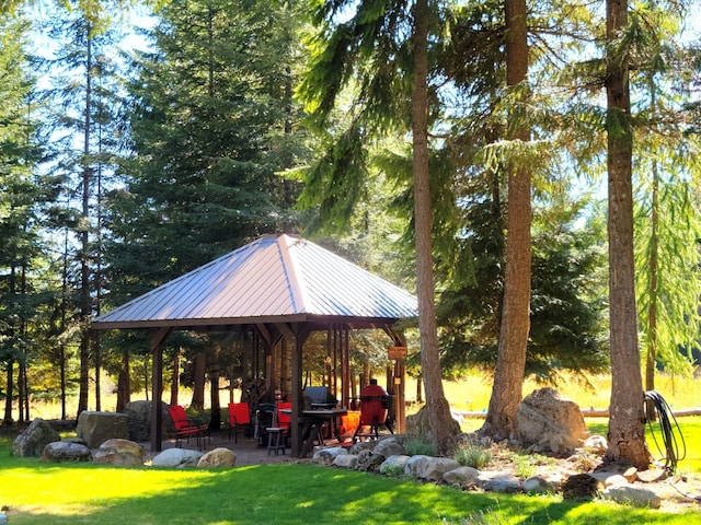 view of community with a lawn and a gazebo