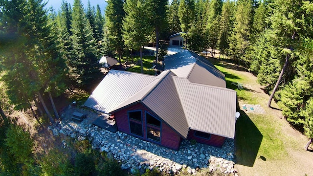 drone / aerial view featuring a view of trees