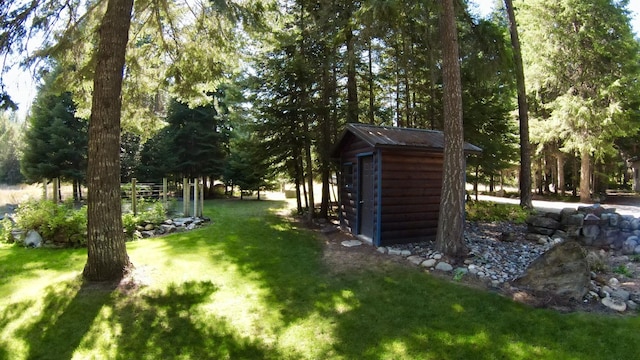 view of yard with an outdoor structure and a shed
