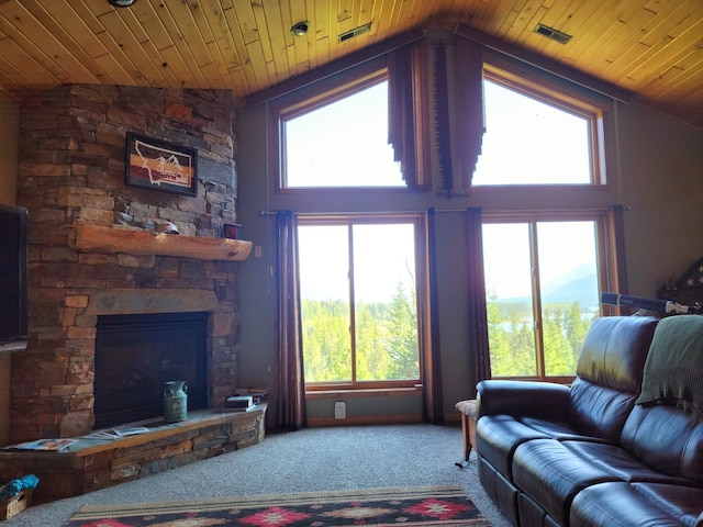 carpeted living room with high vaulted ceiling, wooden ceiling, and a stone fireplace