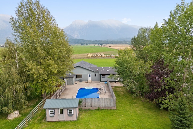 bird's eye view featuring a rural view and a mountain view