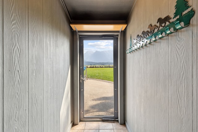 entryway with light tile patterned floors