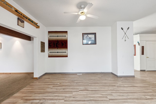 unfurnished living room featuring light hardwood / wood-style flooring and ceiling fan