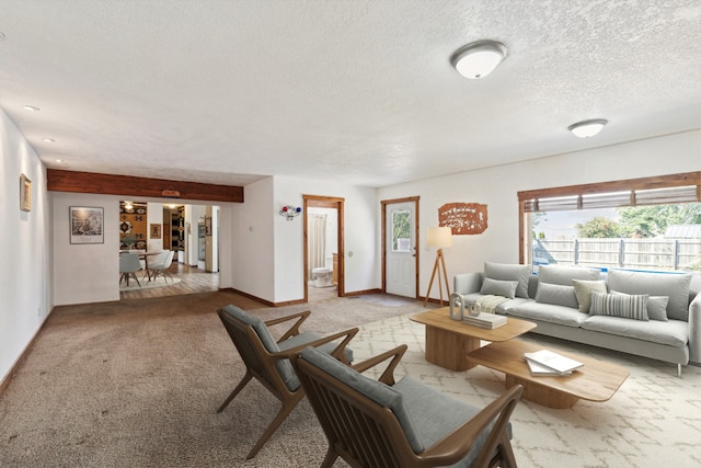 living room with light carpet and a textured ceiling