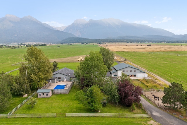 birds eye view of property featuring a mountain view and a rural view