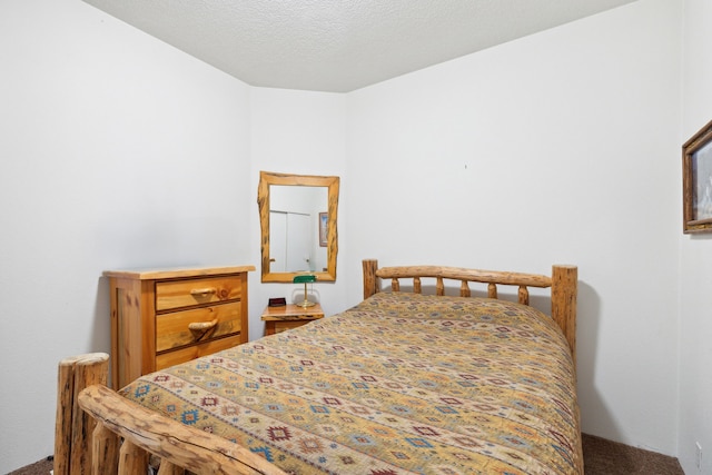 bedroom featuring a textured ceiling