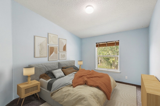 carpeted bedroom with vaulted ceiling and a textured ceiling