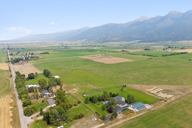 birds eye view of property with a mountain view and a rural view