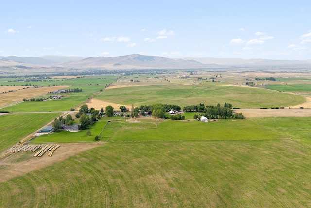 drone / aerial view featuring a mountain view and a rural view