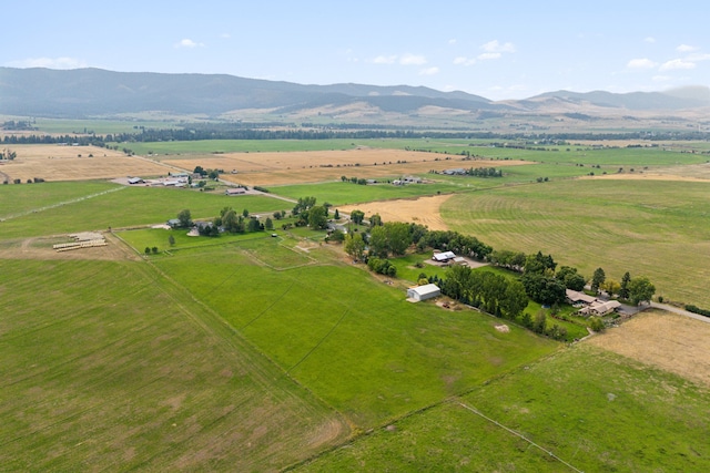 birds eye view of property featuring a mountain view and a rural view