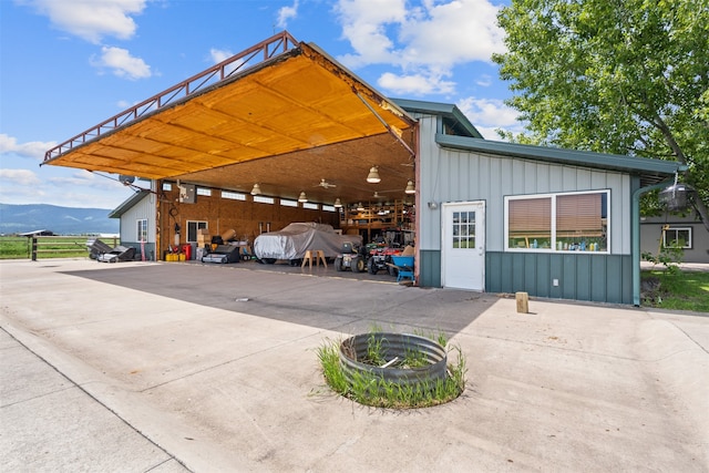 exterior space with a mountain view and a carport