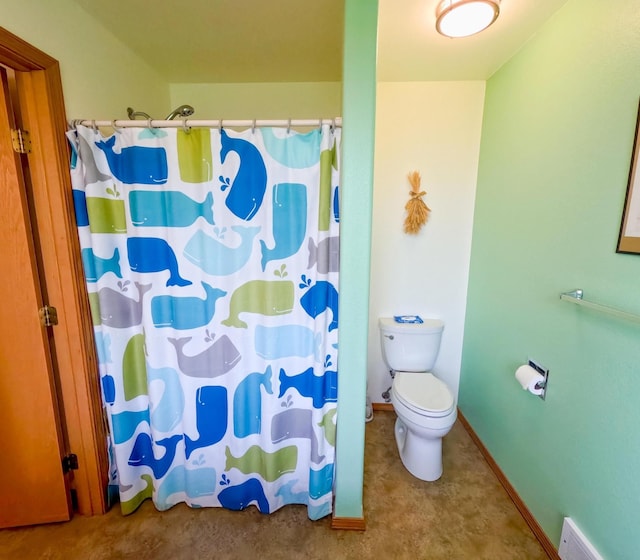 bathroom with toilet and walk in shower