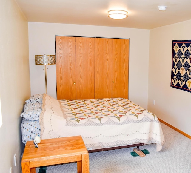 carpeted bedroom featuring a closet