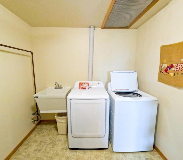 laundry area with sink and independent washer and dryer