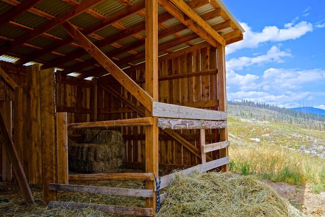 view of horse barn with a mountain view