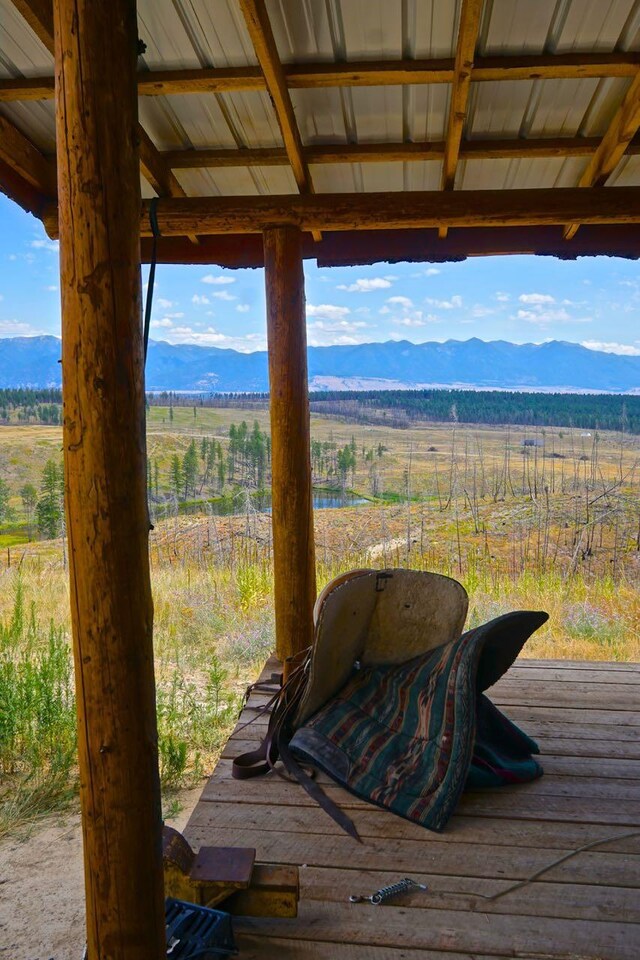 wooden terrace with a mountain view and a rural view