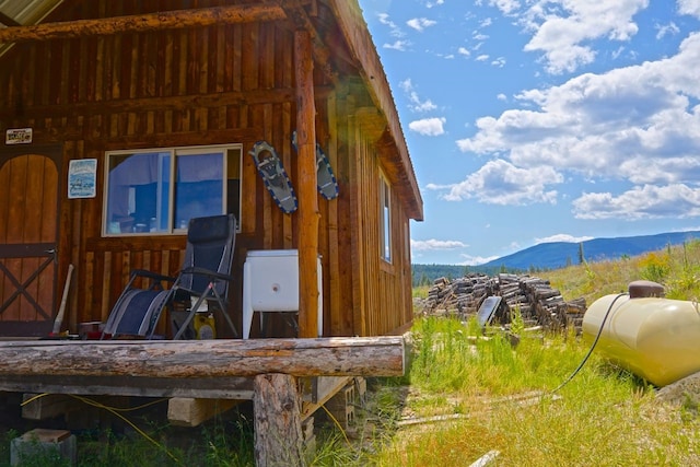 exterior space featuring an outbuilding and a mountain view