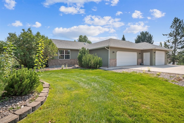 ranch-style house featuring a garage and a front lawn