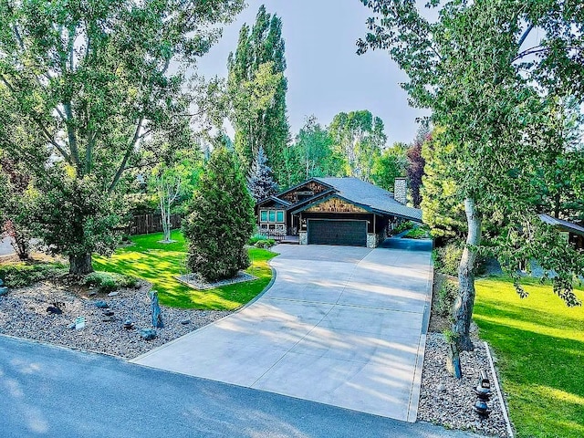 view of front of house with a front yard, a garage, and a carport