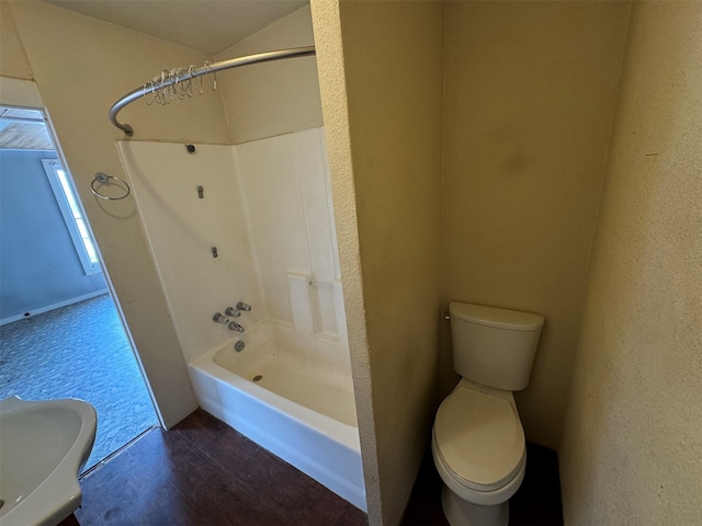 full bathroom with washtub / shower combination, toilet, and sink