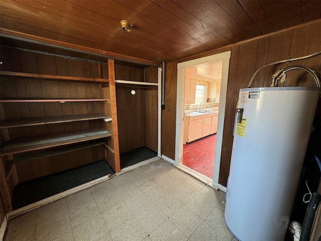 utility room featuring water heater